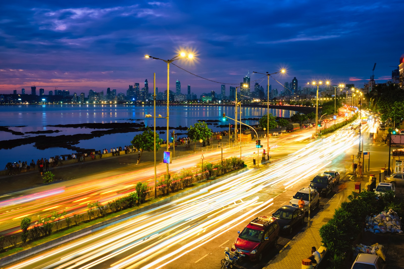 Mumbai's iconic tourist attraction - Queen's Necklace Marine drive at night. Mumbai, Maharashtra, India. Mumbai and Chennai are still the leading destinations for Data Centres as they continue to have the best policies and understanding of the market, while also offering ample power supply infrastructure and services. Photo credit: f9photos | envato GRI Club. India. Data Centres. Real Estate. Infrastructure. Meeting. Conference. Mumbai.